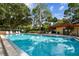 Refreshing community pool with lounge chairs at 2650 Countryside Blvd # C309, Clearwater, FL 33761