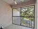 Spacious screened balcony overlooks lush trees and landscape at 2650 Countryside Blvd # C309, Clearwater, FL 33761