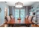 Bright dining room with hardwood floors and a wooden dining table at 2926 W Alline Ave, Tampa, FL 33611