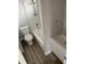 Updated bathroom with a bathtub, shower, and modern vanity at 3066 Kingston St, Port Charlotte, FL 33952