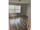 Bright and airy bedroom with wood-look flooring and large windows at 3066 Kingston St, Port Charlotte, FL 33952