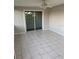 Bright tiled Florida room with sliding glass doors at 3066 Kingston St, Port Charlotte, FL 33952