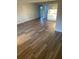 Open living area featuring wood-look floors and lots of natural light at 3066 Kingston St, Port Charlotte, FL 33952