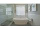 Luxurious bathroom with a soaking tub and glass shower at 3120 W San Pedro St, Tampa, FL 33629