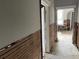 Hallway under renovation, showing exposed walls and woodwork at 331 Pineapple St, Tarpon Springs, FL 34689