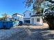 Two-story white house under construction, two-car garage, and partially landscaped yard at 3424 Ohio Ave, Tampa, FL 33611