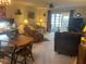 Bright living room with comfortable seating and dining area at 38245 Ironwood Pl # 0, Zephyrhills, FL 33542