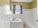 Bathroom featuring tiled walls, a sink vanity, and a bathtub and shower combination at 4024 Grove S St, St Petersburg, FL 33705