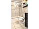 Clean bathroom with a shower/tub combo, toilet and dark-wood vanity at 4214 Trucious Pl, New Port Richey, FL 34652