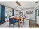 Modern dining room featuring a wooden table and French doors at 4320 63Rd N St, Kenneth City, FL 33709