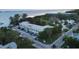 Aerial view of waterfront apartment building with parking at 4902 31St S Ave # 117, Gulfport, FL 33707