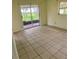 Spacious bedroom with tile floors and sliding glass doors to patio at 4902 31St S Ave # 117, Gulfport, FL 33707