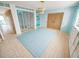 Light and airy entryway with blue accents and unique flooring at 4902 31St S Ave # 117, Gulfport, FL 33707