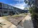 Building exterior with parking and landscaping at 4902 31St S Ave # 117, Gulfport, FL 33707
