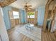 Beachfront living room with light blue walls and ocean views at 4902 31St S Ave # 117, Gulfport, FL 33707