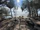 Relaxing waterfront view with chairs and trees at 4902 31St S Ave # 117, Gulfport, FL 33707