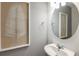 Clean and simple bathroom with a single vanity and a large mirror at 5309 Wolf Creek Dr, Apollo Beach, FL 33572