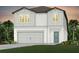 Two-story house with gray siding, two-car garage, and landscaping at 5309 Wolf Creek Dr, Apollo Beach, FL 33572