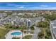 Stunning aerial view of community, pool, and marina at 5567 Sea Forest Dr # 320, New Port Richey, FL 34652