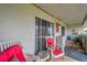 Covered balcony with comfortable seating and peaceful views at 5567 Sea Forest Dr # 320, New Port Richey, FL 34652