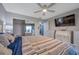 Spacious bedroom with large TV and mirrored closet at 5567 Sea Forest Dr # 320, New Port Richey, FL 34652