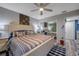 Bright bedroom with king-size bed and mirrored closet at 5567 Sea Forest Dr # 320, New Port Richey, FL 34652