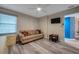 Comfortable bedroom with a sofa and access to another room at 5567 Sea Forest Dr # 320, New Port Richey, FL 34652