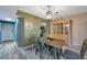 Dining area with table and chairs, view to kitchen and living room at 5567 Sea Forest Dr # 320, New Port Richey, FL 34652