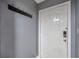 Condo entryway with white door and coat rack at 5567 Sea Forest Dr # 320, New Port Richey, FL 34652
