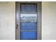 Condo's front door with storm door and number 320 at 5567 Sea Forest Dr # 320, New Port Richey, FL 34652