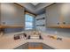 Compact kitchen with corner sink and wood cabinets at 5567 Sea Forest Dr # 320, New Port Richey, FL 34652