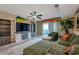 Spacious living room with sectional sofa, large TV, and access to a balcony at 5567 Sea Forest Dr # 320, New Port Richey, FL 34652