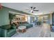 Open concept living area with sectional sofa and views into the dining and kitchen areas at 5567 Sea Forest Dr # 320, New Port Richey, FL 34652