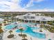 Community pool and clubhouse with surrounding homes at 5672 Bay Tide Ct, Land O Lakes, FL 34638