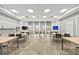 Community room with tables, chairs, and a kitchen area at 5672 Bay Tide Ct, Land O Lakes, FL 34638