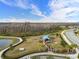 Community dog park with agility equipment and shaded seating at 5672 Bay Tide Ct, Land O Lakes, FL 34638