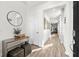 Light-filled hallway with wood floors and modern decor at 5672 Bay Tide Ct, Land O Lakes, FL 34638