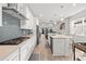 Open concept kitchen with a large island and view to living area at 5672 Bay Tide Ct, Land O Lakes, FL 34638