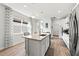 Modern kitchen with an island and stainless steel appliances at 5672 Bay Tide Ct, Land O Lakes, FL 34638