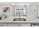 Kitchen island with a farmhouse sink and window view at 5672 Bay Tide Ct, Land O Lakes, FL 34638