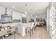 Open concept kitchen with island and view into dining area at 5672 Bay Tide Ct, Land O Lakes, FL 34638