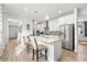 Modern kitchen with island, stainless steel appliances, and light wood flooring at 5672 Bay Tide Ct, Land O Lakes, FL 34638