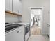 Laundry room with a view into the kitchen at 5672 Bay Tide Ct, Land O Lakes, FL 34638