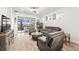 Relaxing living room with a cozy seating area and sliding doors to a patio at 5672 Bay Tide Ct, Land O Lakes, FL 34638