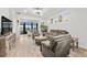 Spacious living room, hardwood floors, and access to a patio at 5672 Bay Tide Ct, Land O Lakes, FL 34638