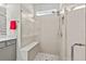Large walk-in shower with built-in seat and pebble floor at 5672 Bay Tide Ct, Land O Lakes, FL 34638