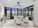 Sunroom with seating area and access to backyard at 5672 Bay Tide Ct, Land O Lakes, FL 34638