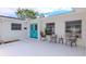 Welcoming front porch with teal doors and sitting area at 5912 32Nd N Ave, St Petersburg, FL 33710