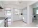 Bright kitchen with stainless steel appliances and access to a screened porch at 5912 32Nd N Ave, St Petersburg, FL 33710