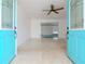 Bright living room with teal doors and terrazzo floor at 5912 32Nd N Ave, St Petersburg, FL 33710